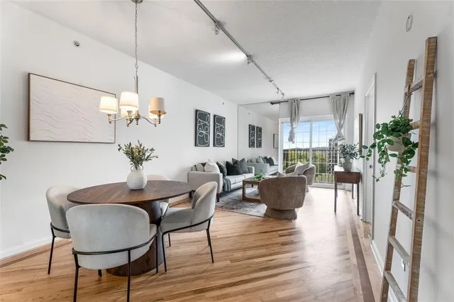 a view of a dining room with furniture window and wooden floor