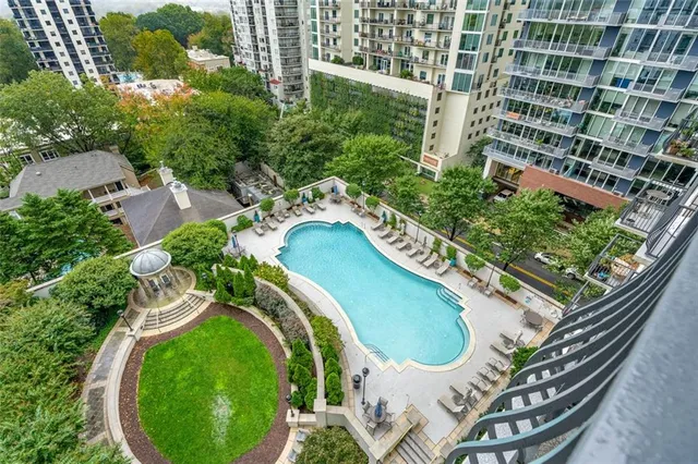 an aerial view of a swimming pool and outdoor space