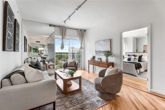 a living room with furniture and a large window
