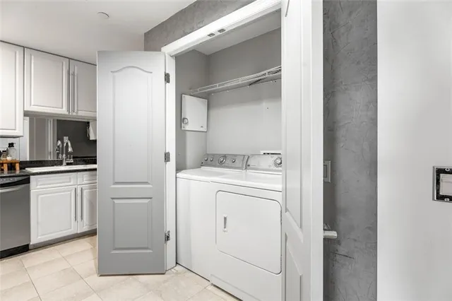 a view of washer and dryer with kitchen appliances