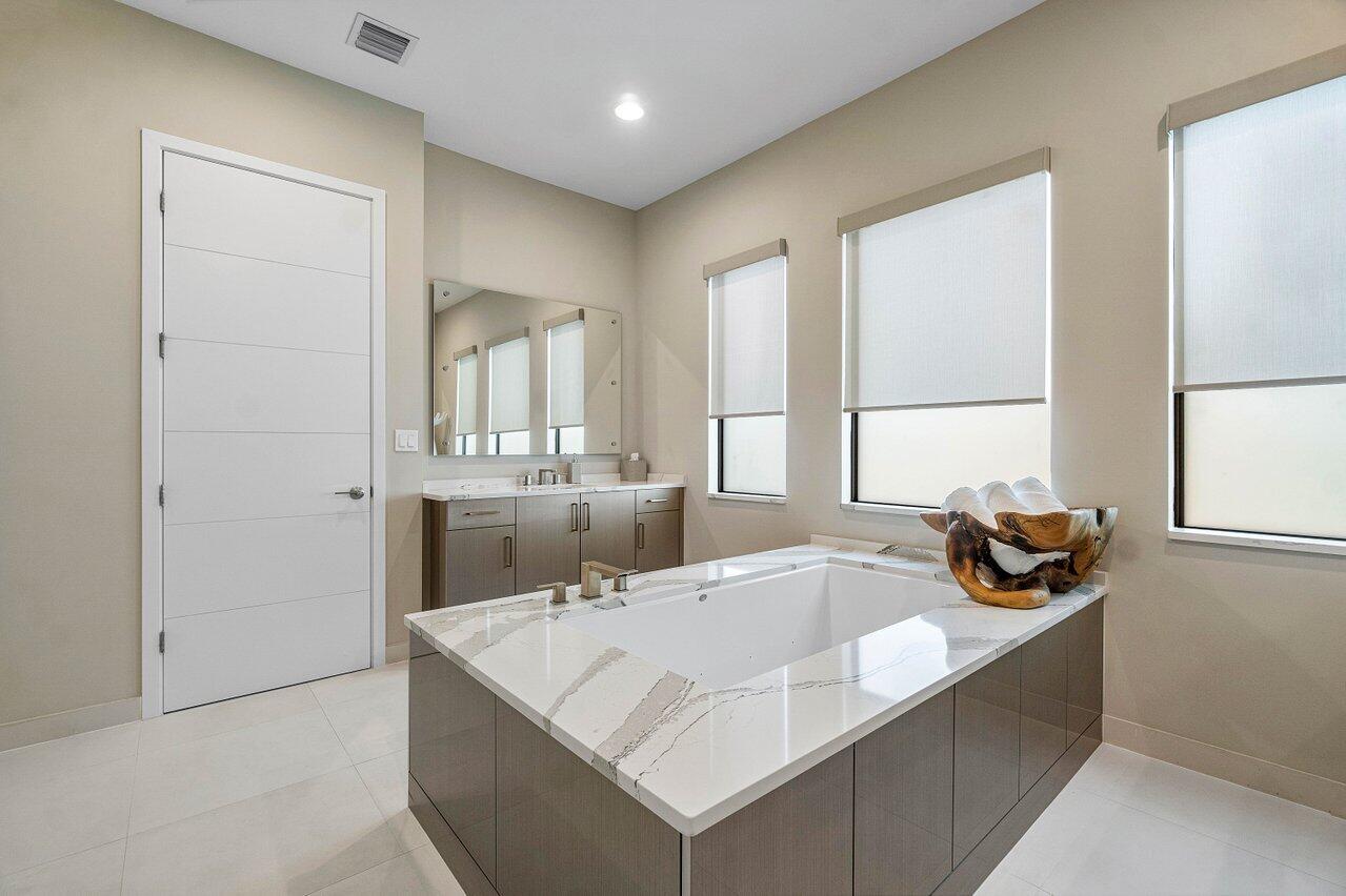 8581 Dearborn River Way Boca Raton, FL 33496 - Photo 14 of 53 a kitchen with a sink and a window