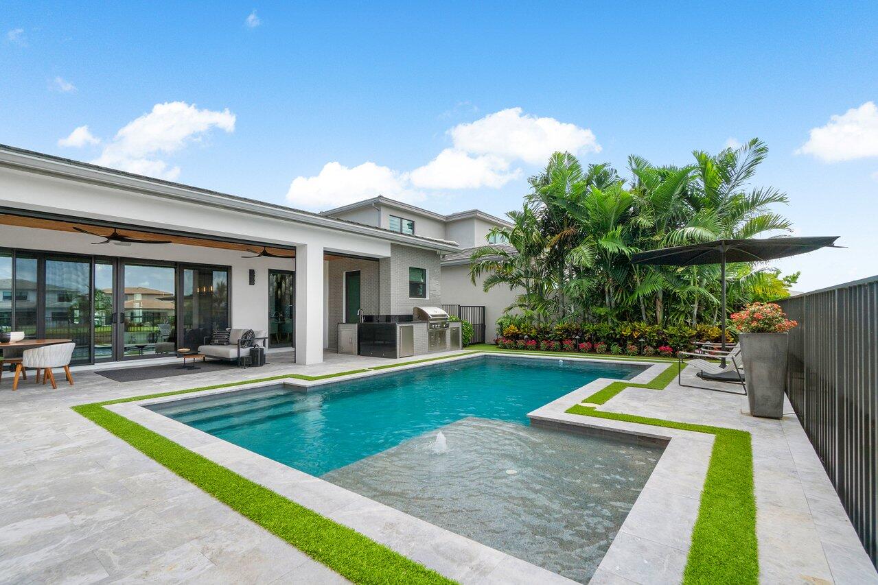 8581 Dearborn River Way Boca Raton, FL 33496 - Photo 26 of 53 a view of a house with swimming pool and sitting area
