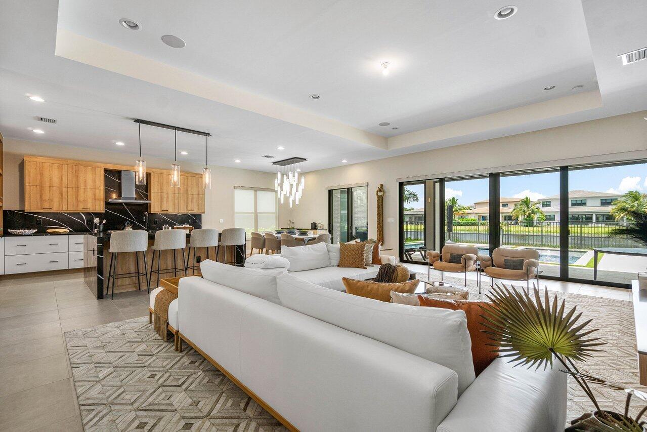 8581 Dearborn River Way Boca Raton, FL 33496 - Photo 6 of 53 a living room with furniture and a large window