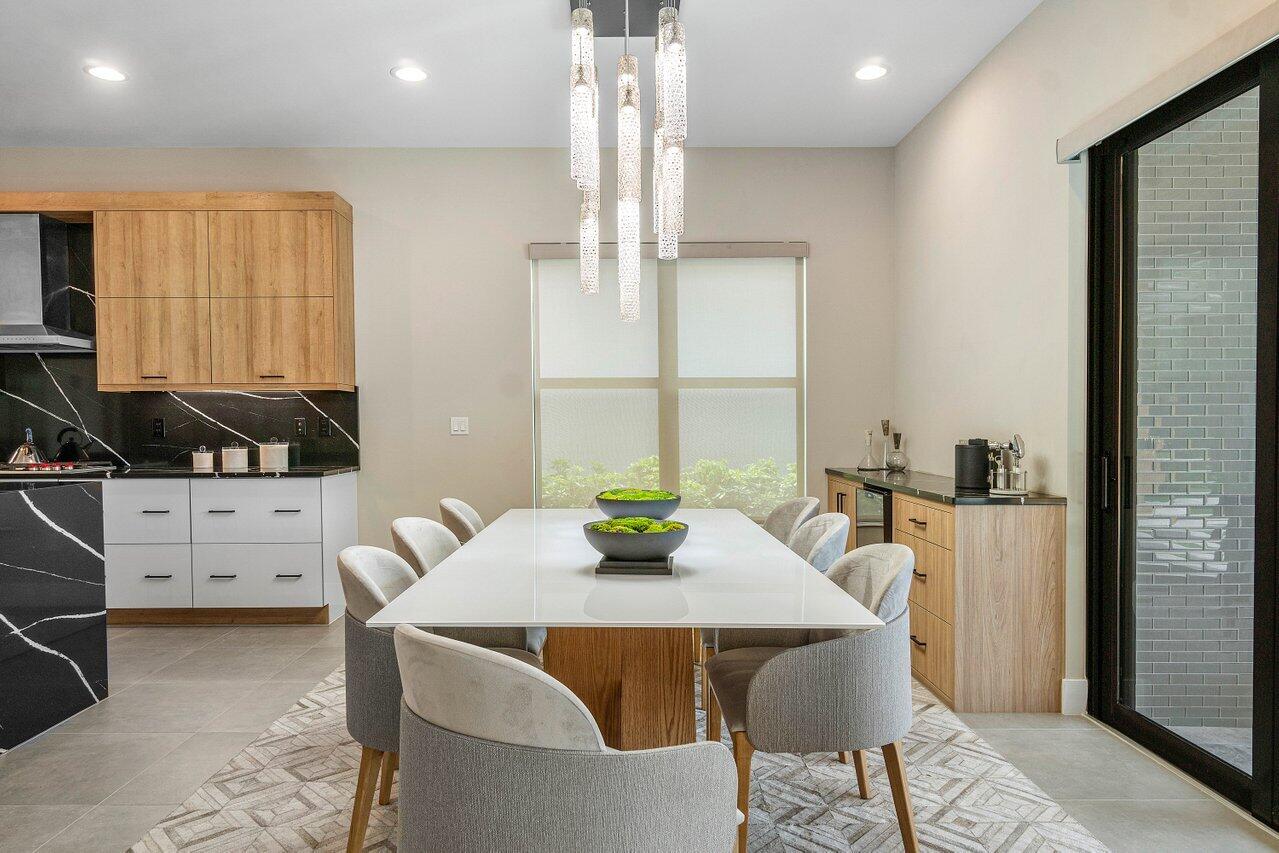8581 Dearborn River Way Boca Raton, FL 33496 - Photo 10 of 53 a view of a dining room with furniture and window
