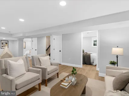 a living room with furniture and a lamp