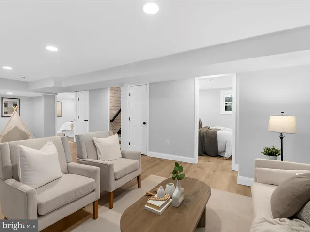 a living room with furniture and a lamp