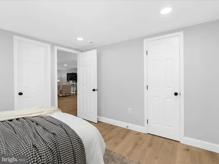 a bedroom with a bed and closet