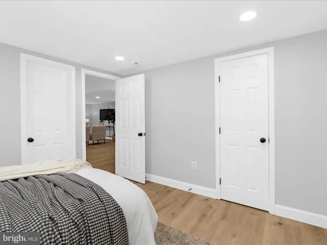 a bedroom with a bed and closet