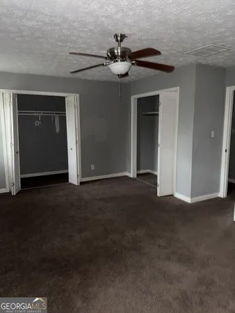 a view of a livingroom with a ceiling fan