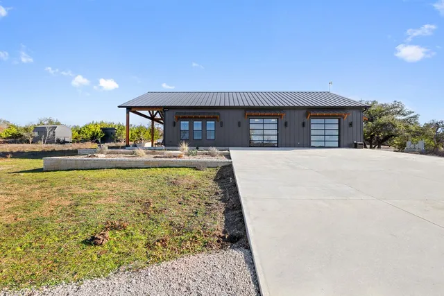 an empty room with fan and windows