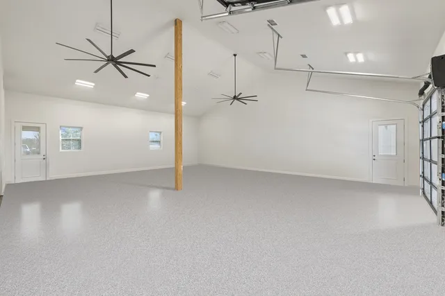 a view of an ocean with a table and chairs