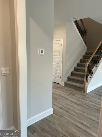 a view of entryway with wooden floor
