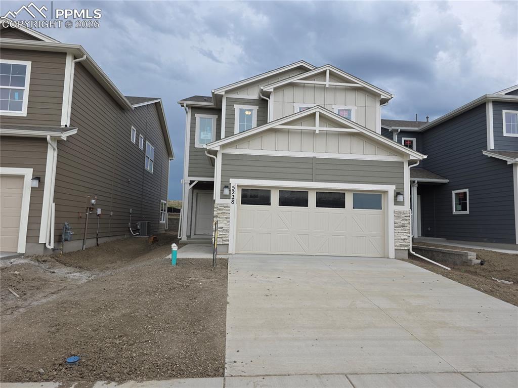 5356 Truscott Road Colorado Springs, CO 80925 - Photo 2 of 16 a view of a house with a large window