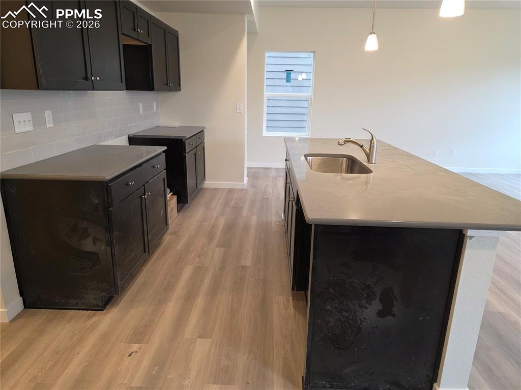 5356 Truscott Road Colorado Springs, CO 80925 - Photo 5 of 16 a kitchen with a sink and cabinets