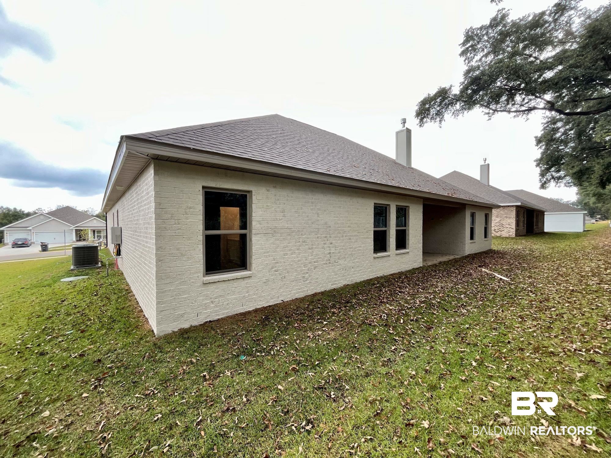 330 Barndling Street Fairhope, AL 36532 - Photo 27 of 31 View of property exterior with a yard and cooling unit