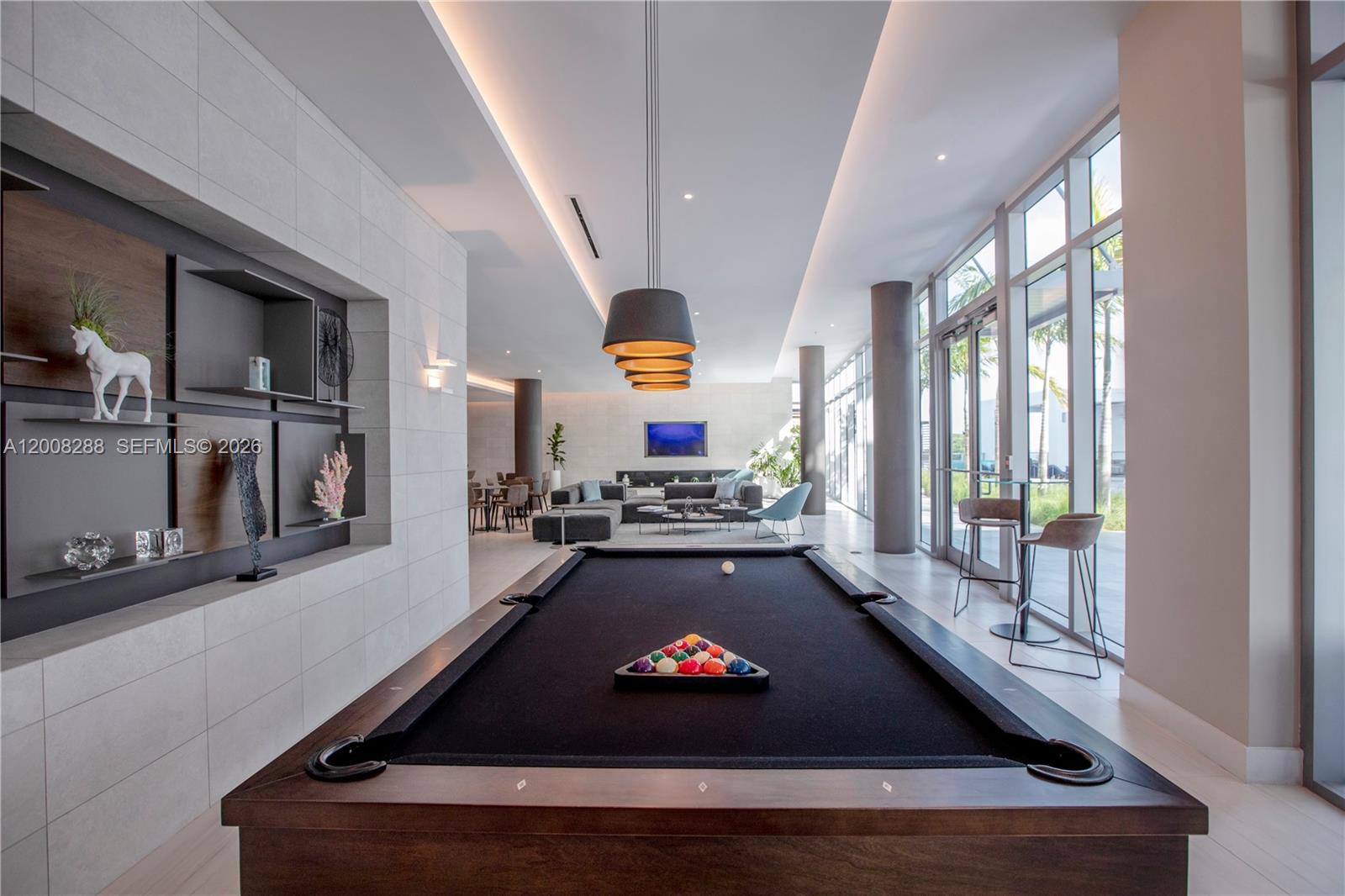 3900 Biscayne Boulevard, Unit S906 Miami, FL 33137 - Photo 17 of 17 a room with pool table and a large window