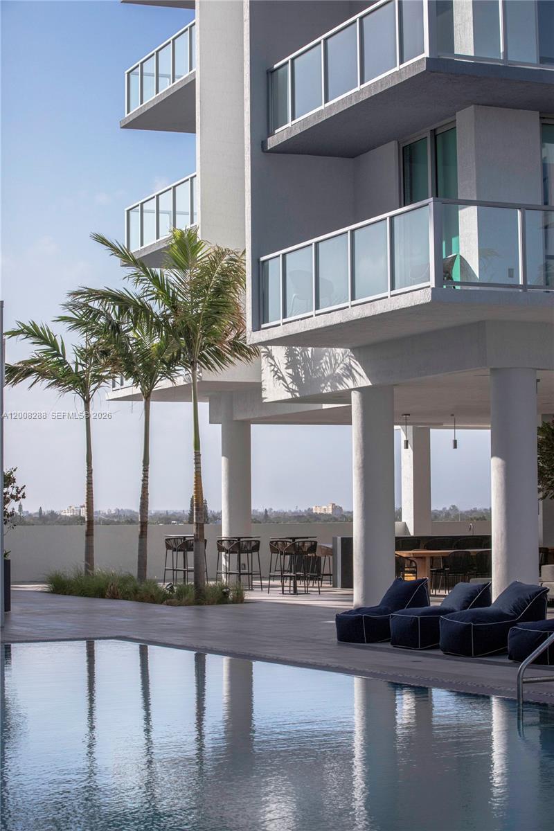 3900 Biscayne Boulevard, Unit S906 Miami, FL 33137 - Photo 9 of 17 a front view of a house with lake view and a floor to ceiling window