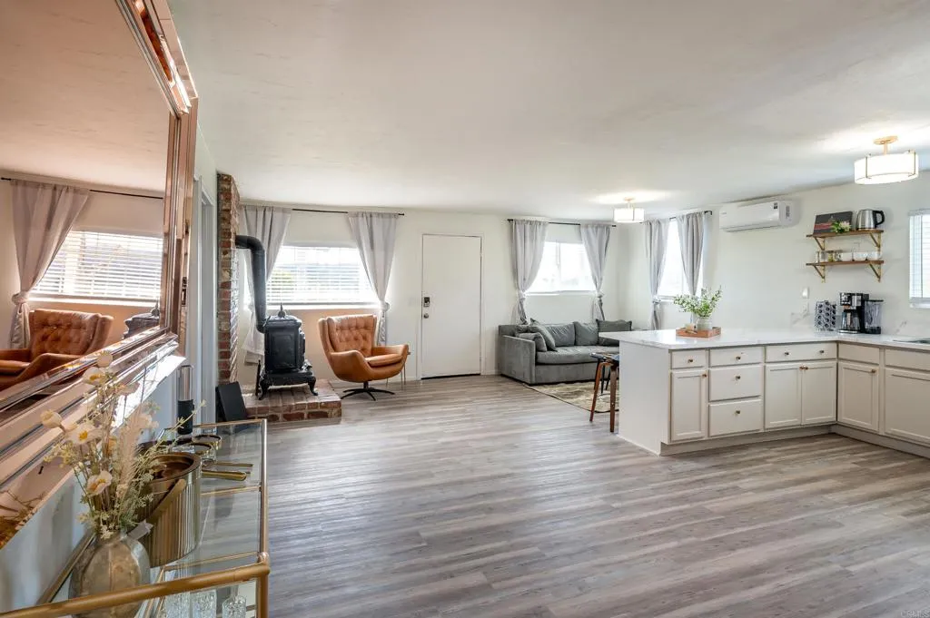 26086 Bear Valley Heights Road Valley Center, CA 92082 - Photo 14 of 65 a living room with furniture and a flat screen tv