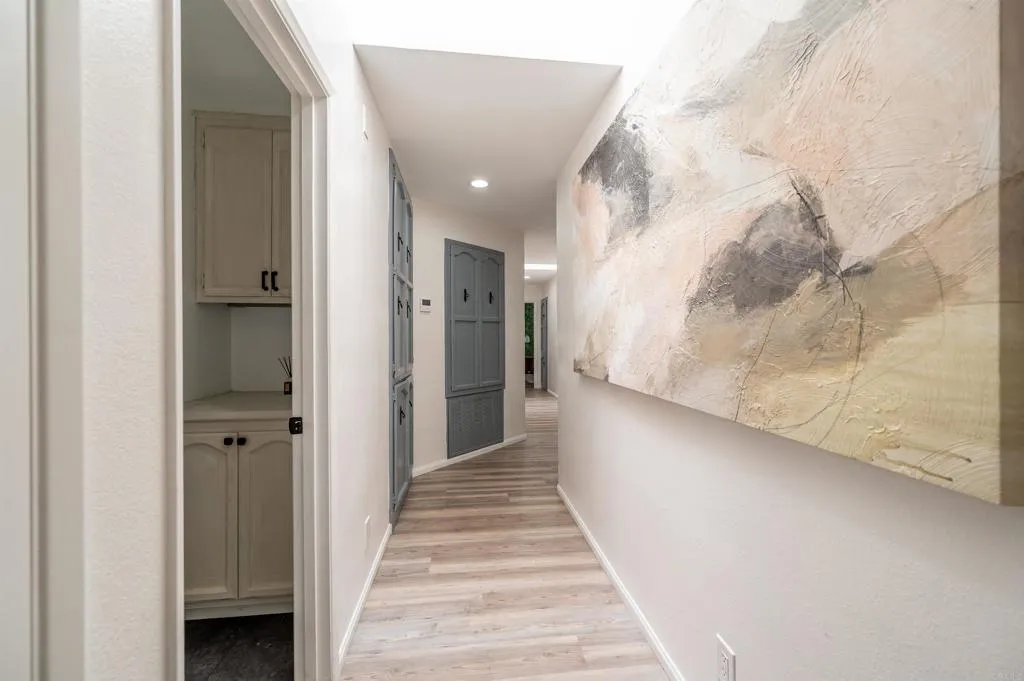 26086 Bear Valley Heights Road Valley Center, CA 92082 - Photo 37 of 65 a view of a hallway with wooden floor and entryway