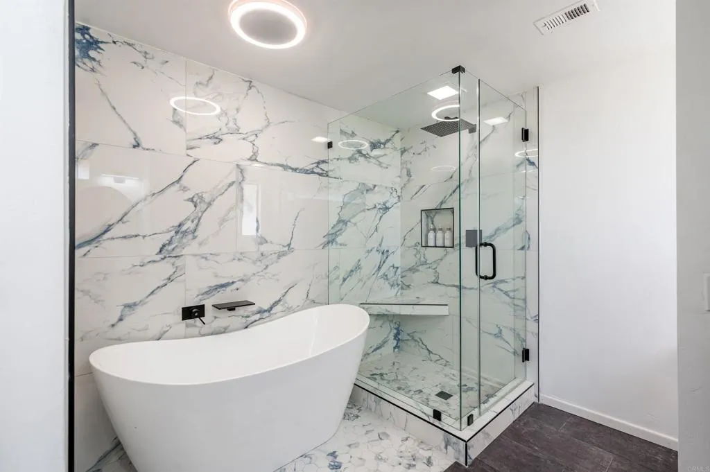 26086 Bear Valley Heights Road Valley Center, CA 92082 - Photo 44 of 65 a bathroom with a bathtub and shower