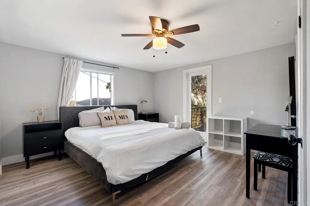 26086 Bear Valley Heights Road Valley Center, CA 92082 - Photo 60 of 65 a bedroom with a bed and a table in it