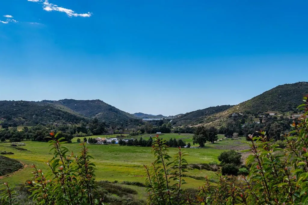26086 Bear Valley Heights Road Valley Center, CA 92082 - Photo 64 of 65 a view of a town with mountains in the background
