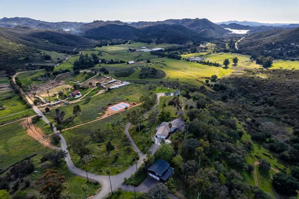 26086 Bear Valley Heights Road Valley Center, CA 92082 - Photo 65 of 65 a view of a house with a lake and a mountain
