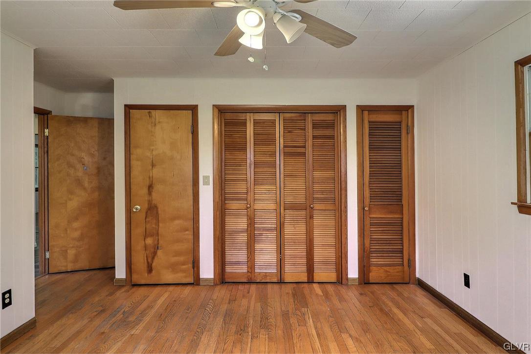 122 James Lane Stroudsburg, PA 18360 - Photo 21 of 50 an empty room with wooden floor and windows