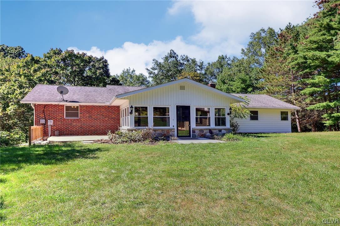 122 James Lane Stroudsburg, PA 18360 - Photo 25 of 50 a front view of a house with a garden