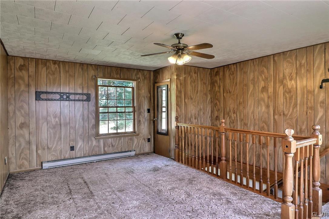 122 James Lane Stroudsburg, PA 18360 - Photo 43 of 50 en empty room with windows and ceiling fan