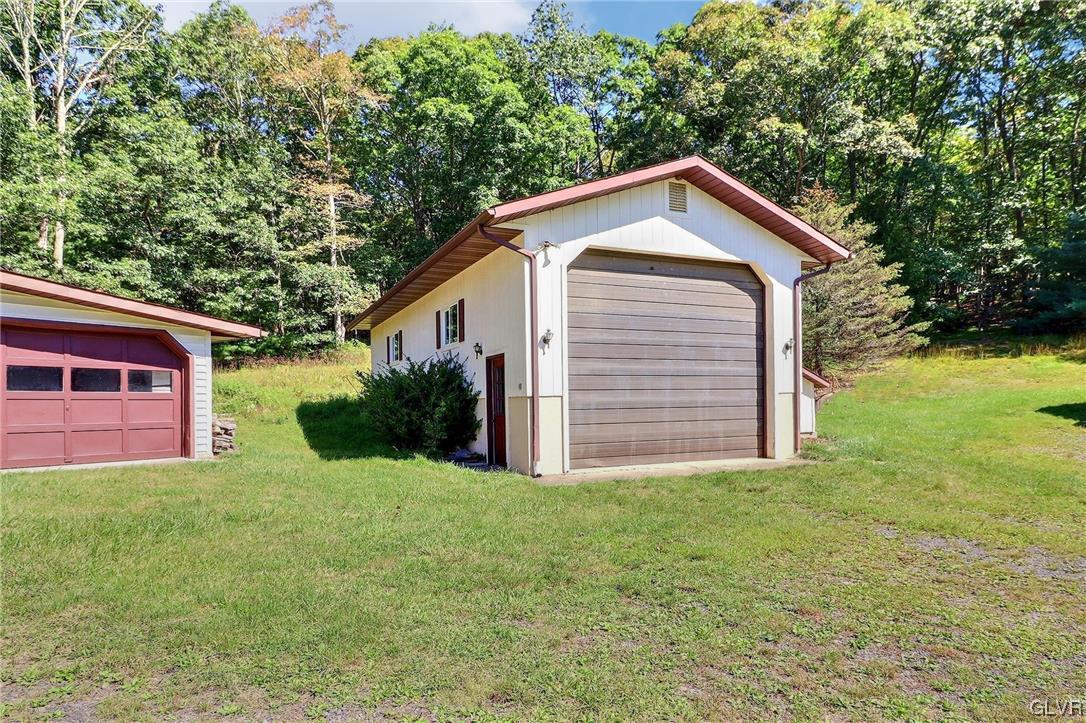 122 James Lane Stroudsburg, PA 18360 - Photo 48 of 50 a view of a house with yard and a garden