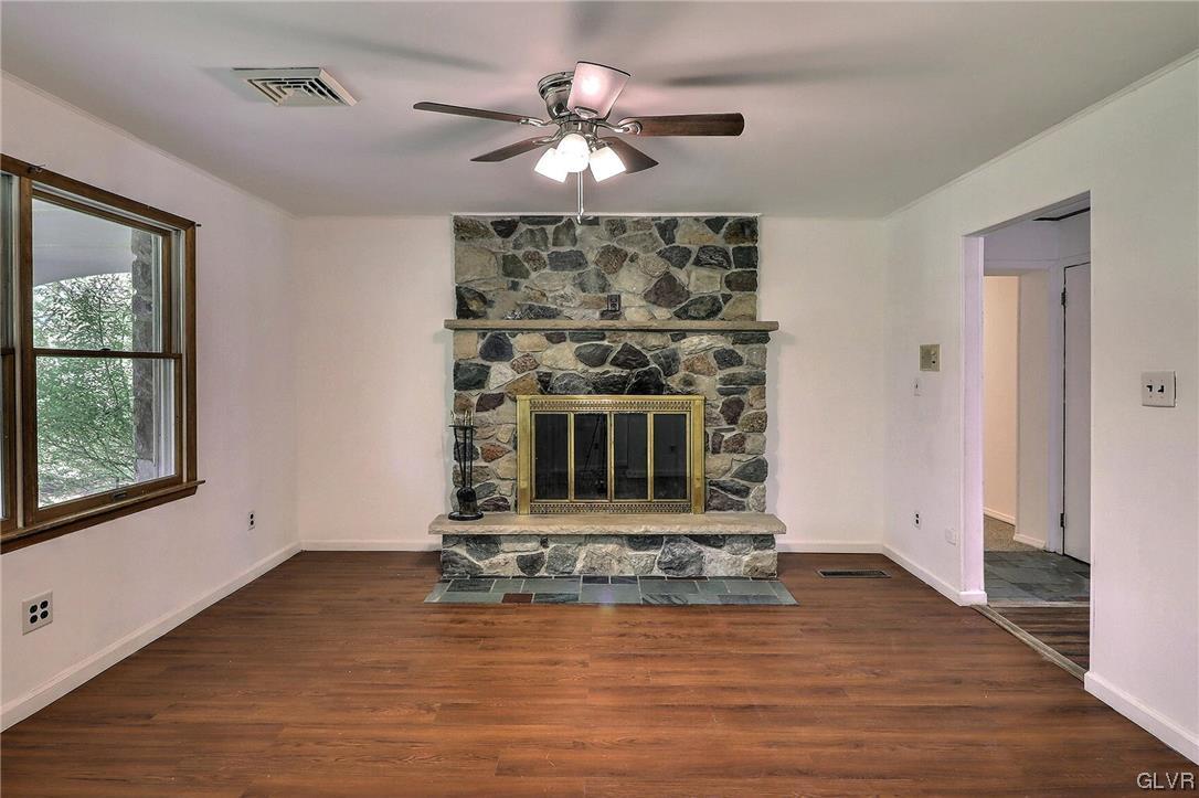 122 James Lane Stroudsburg, PA 18360 - Photo 8 of 50 a living room with fireplace and wooden floor