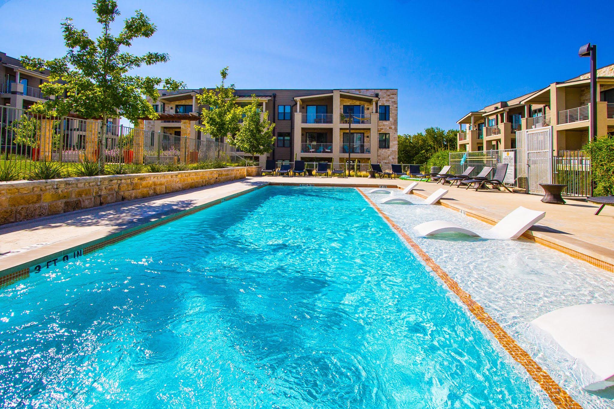 2804 Treble Lane, Unit 902 Austin, TX 78704 - Photo 16 of 18 a view of swimming pool with outdoor seating and yard