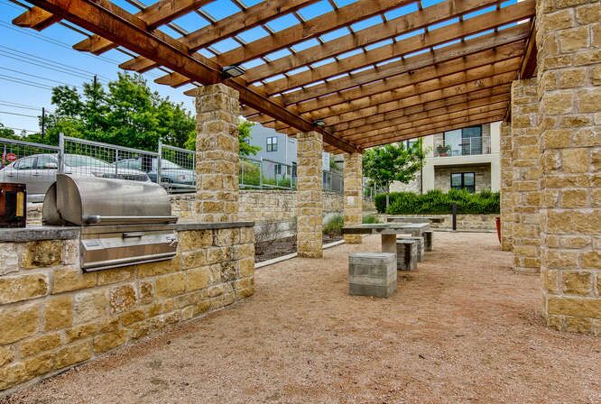 2804 Treble Lane, Unit 902 Austin, TX 78704 - Photo 17 of 18 a view of a patio with table and chairs and potted plants