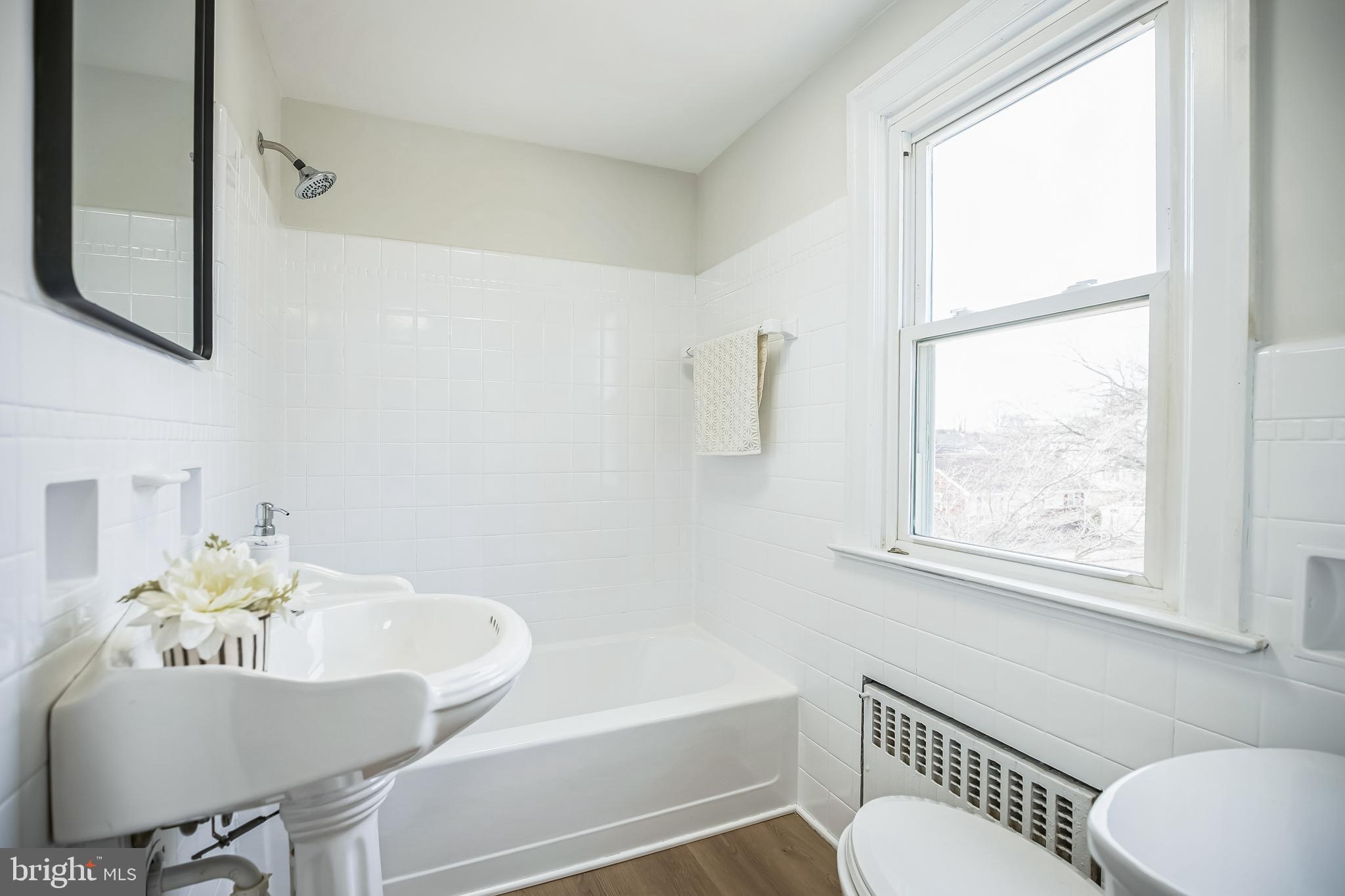 89 Reed Avenue Hamilton, NJ 08610 - Photo 18 of 30 a bathroom with a sink and a bathtub