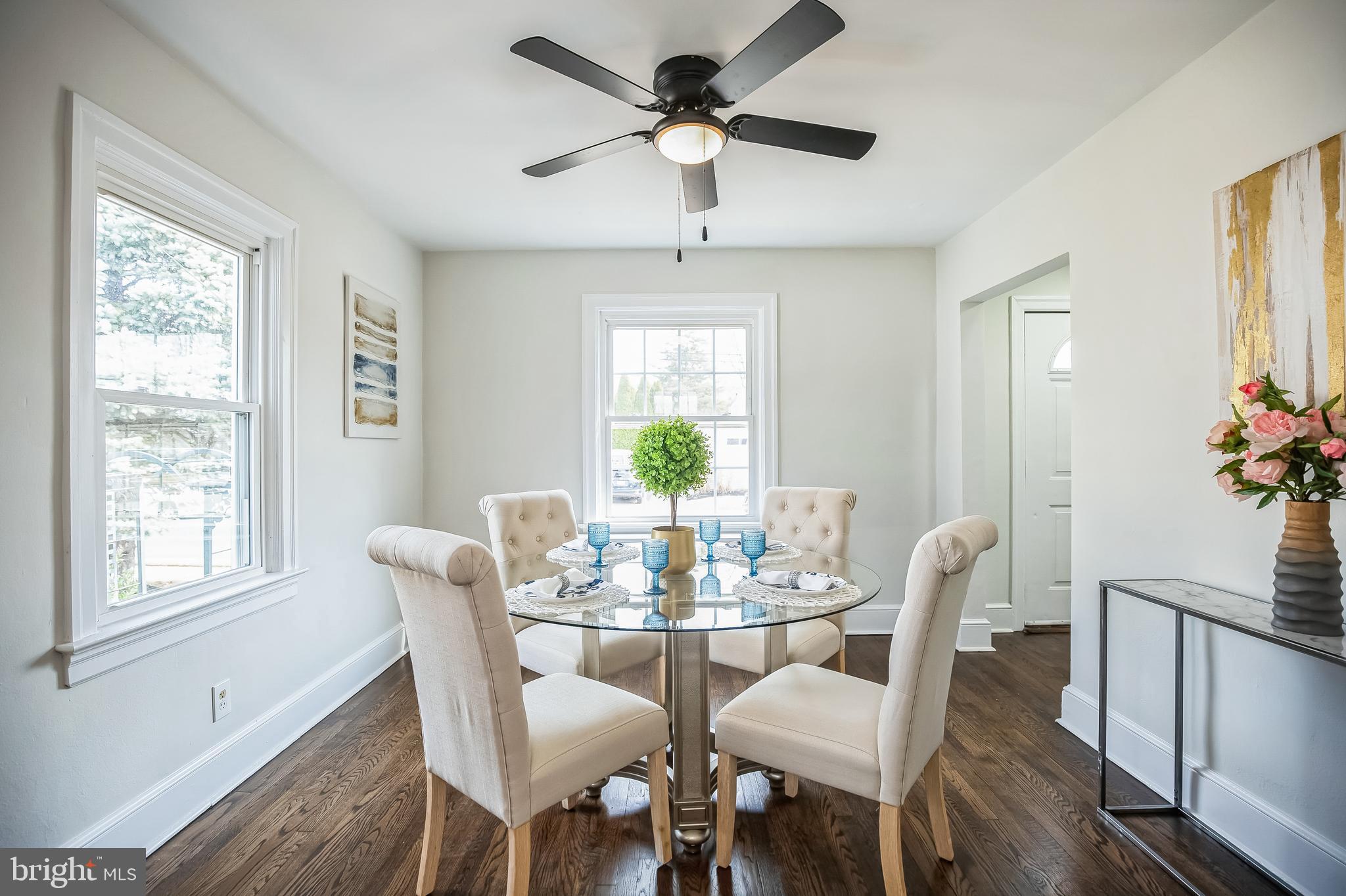 89 Reed Avenue Hamilton, NJ 08610 - Photo 3 of 30 a dining room with furniture a chandelier and wooden floor