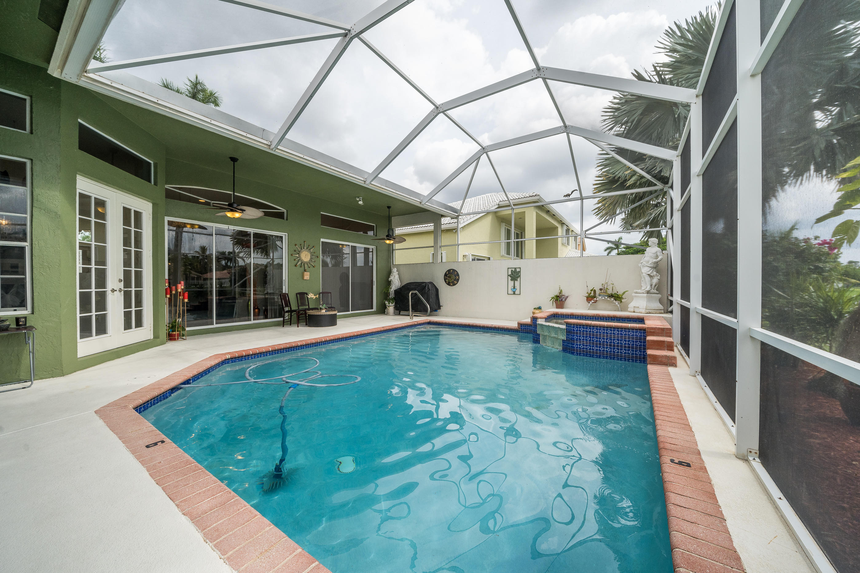 10870 Haydn Drive Boca Raton, FL 33498 - Photo 37 of 49 Screened Patio w/Pool