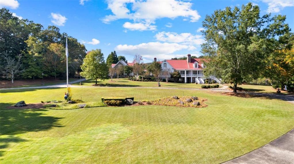 5225 Chalybeate Springs Road Woodland, GA 31836 - Photo 60 of 100 a view of an swimming pool with an outdoor seating