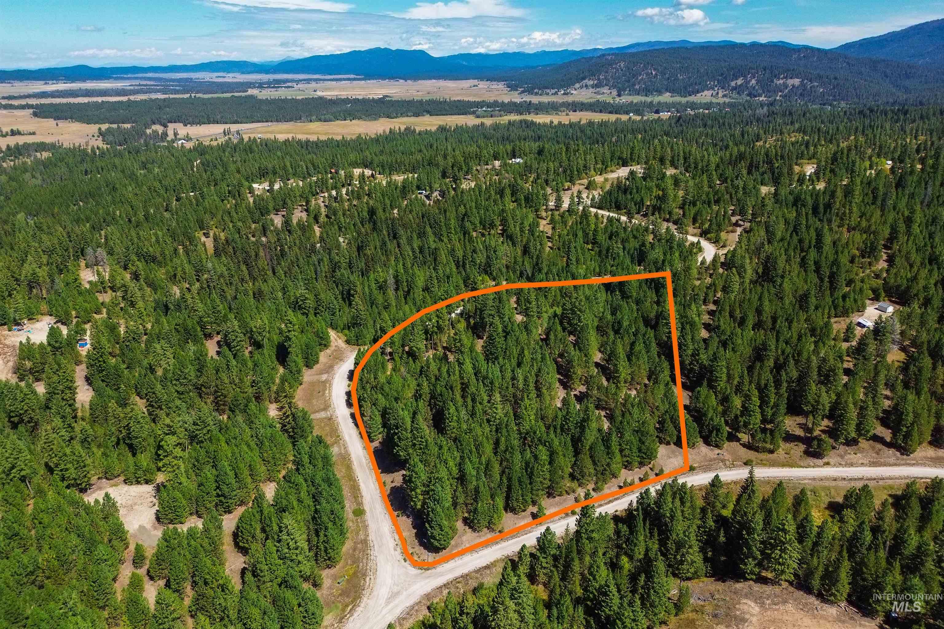 47 Coit Drive Cascade, ID 83611 - Photo 2 of 34 Aerial overview of property's location with mountains and property parcel outlined