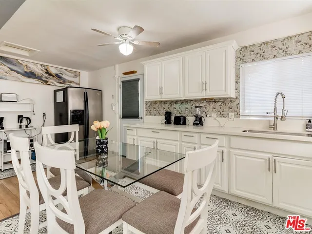a kitchen with a sink cabinets and window