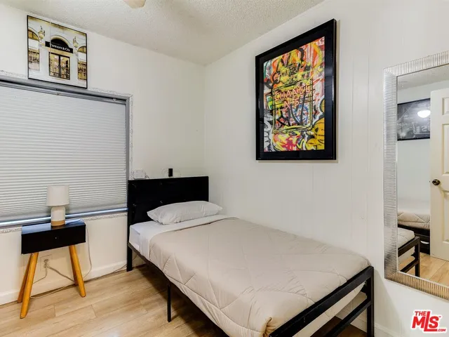 a bedroom with a bed and the furniture