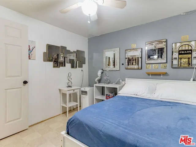 a bed room with a bed and furniture