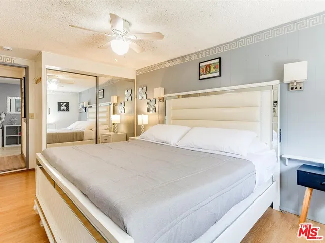 a large white bed in a white room