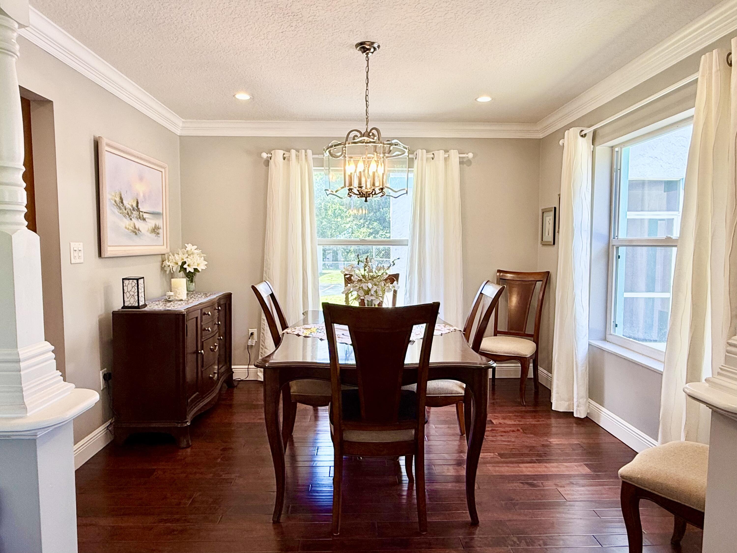 16283 Alexander Run Jupiter, FL 33478 - Photo 12 of 96 a view of a dining room with furniture window and wooden floor