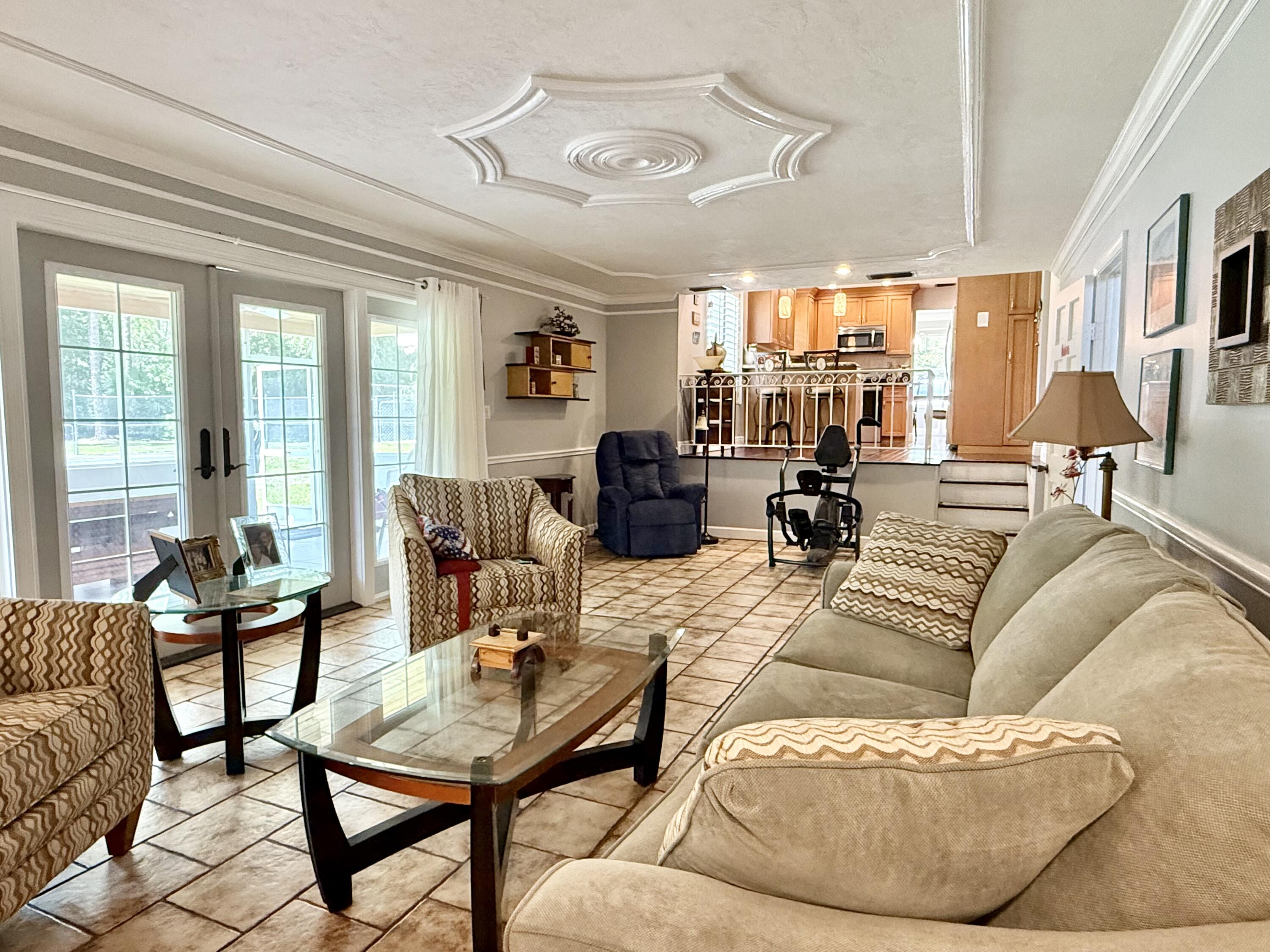 16283 Alexander Run Jupiter, FL 33478 - Photo 13 of 96 a living room with furniture and a large window