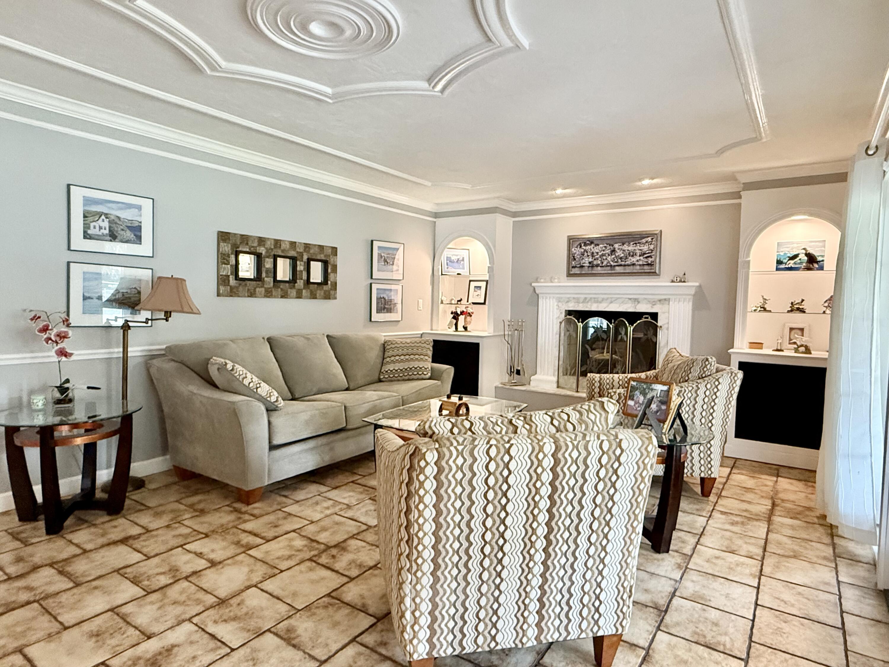 16283 Alexander Run Jupiter, FL 33478 - Photo 16 of 96 a living room with furniture and a fireplace