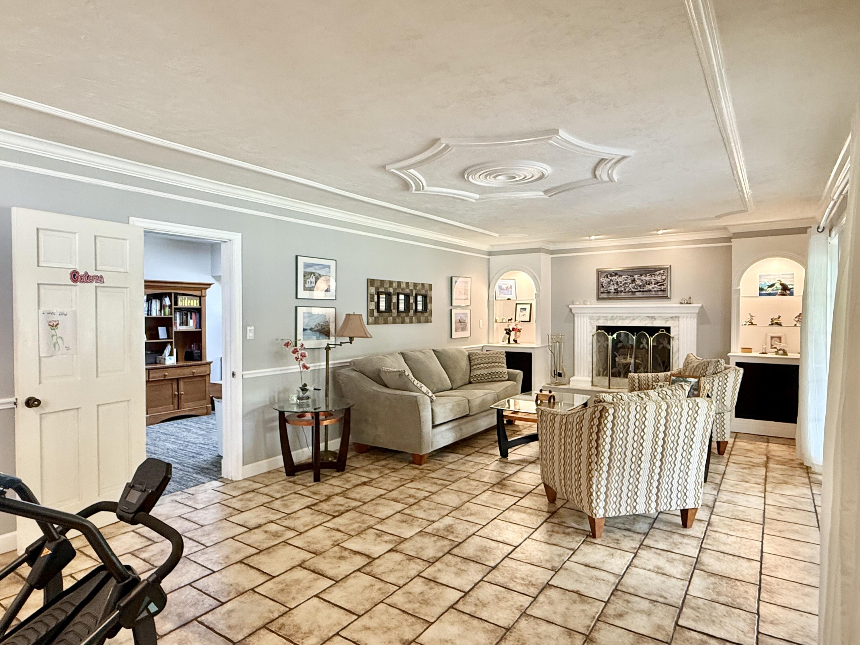 16283 Alexander Run Jupiter, FL 33478 - Photo 17 of 96 a living room with furniture and a flat screen tv