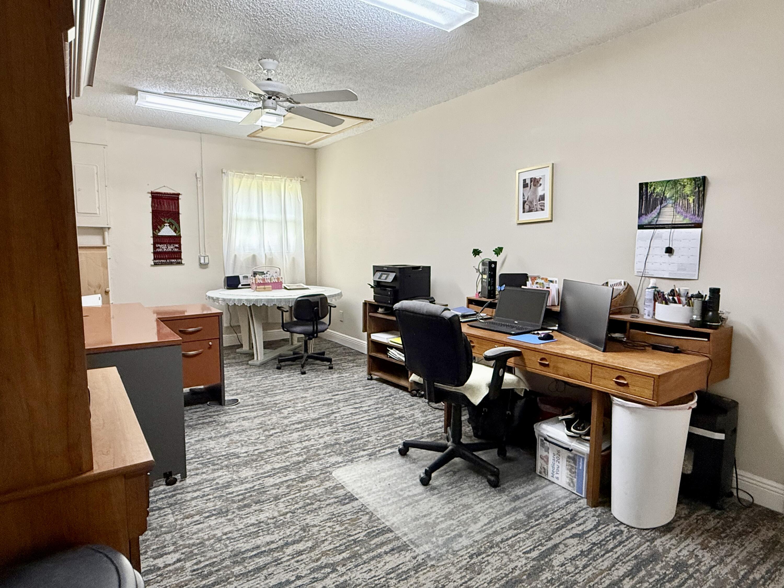 16283 Alexander Run Jupiter, FL 33478 - Photo 35 of 96 a view of a workspace with wooden floor