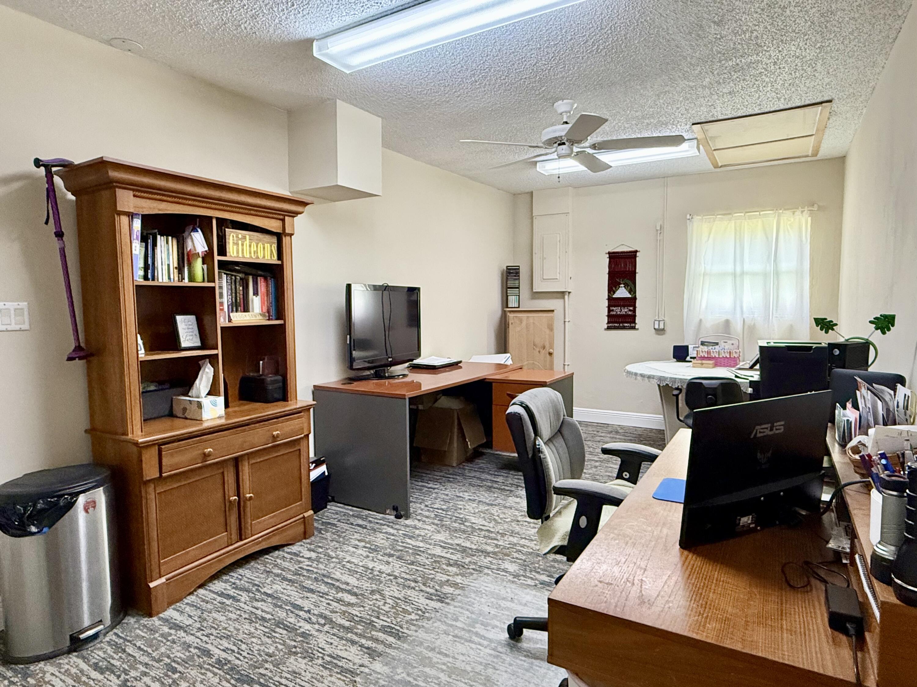16283 Alexander Run Jupiter, FL 33478 - Photo 36 of 96 a view of a workspace with furniture and a window