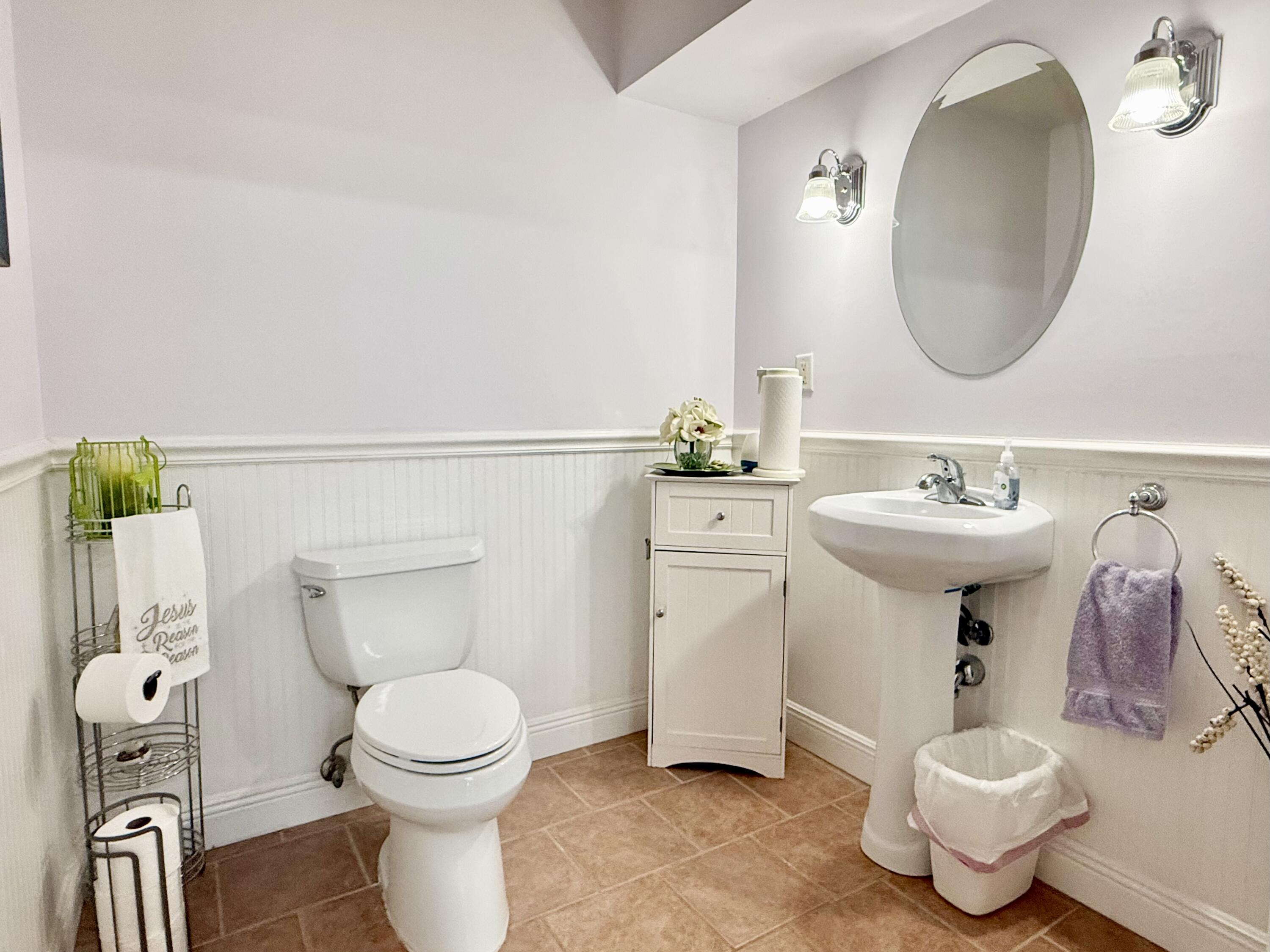 16283 Alexander Run Jupiter, FL 33478 - Photo 37 of 96 a bathroom with a toilet sink and mirror